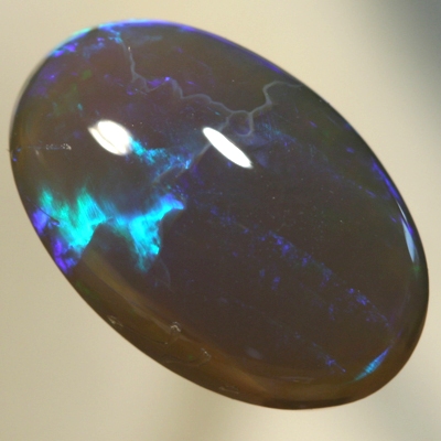 SOLID BLACK CRYSTAL OPAL Two large rolling flashes, green and turquoise shades SEE VIDEO